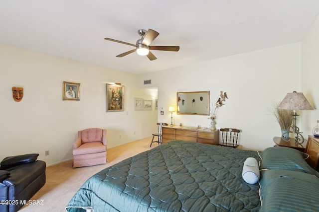 bedroom with carpet flooring, a ceiling fan, and visible vents