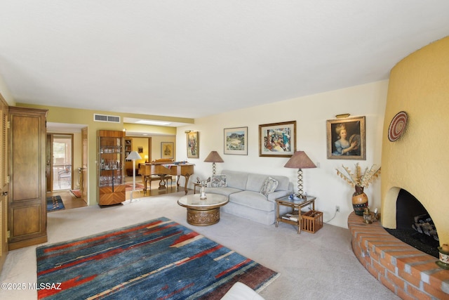 carpeted living room featuring visible vents and a fireplace