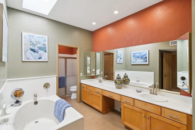 full bath with visible vents, toilet, a skylight, and a bath