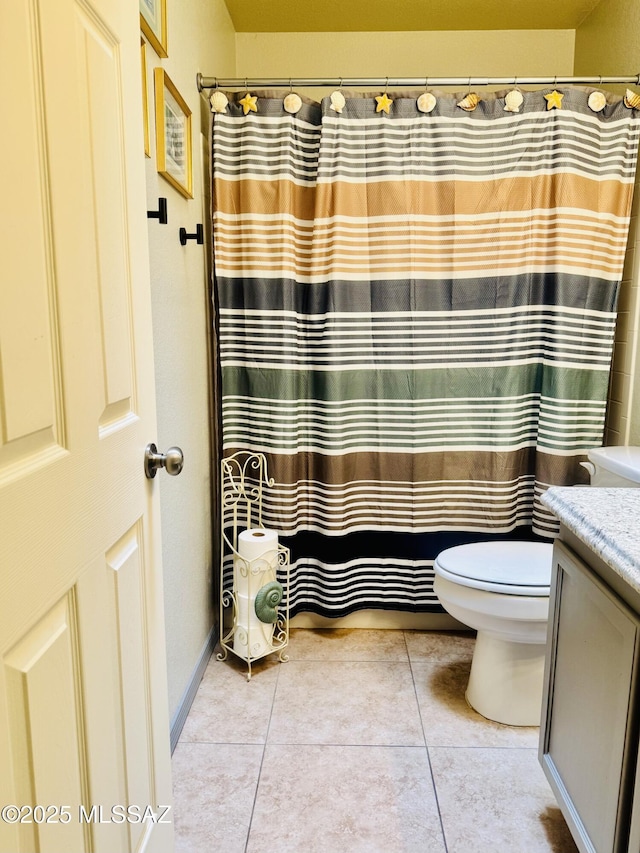 full bathroom with a shower with shower curtain, vanity, toilet, and tile patterned floors