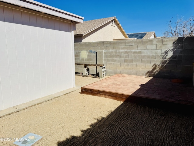 view of patio featuring fence