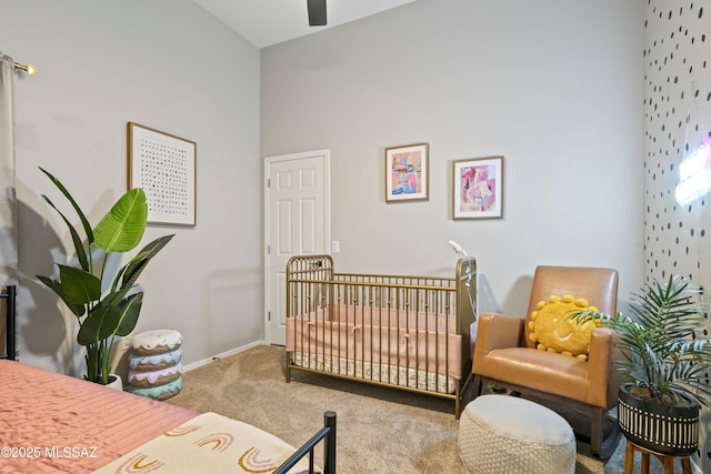 bedroom featuring carpet and baseboards