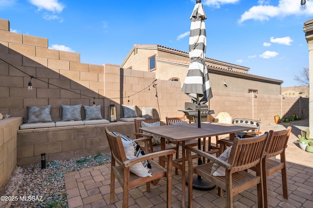 view of patio / terrace featuring a fenced backyard and outdoor dining area