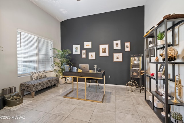 office featuring tile patterned flooring and baseboards