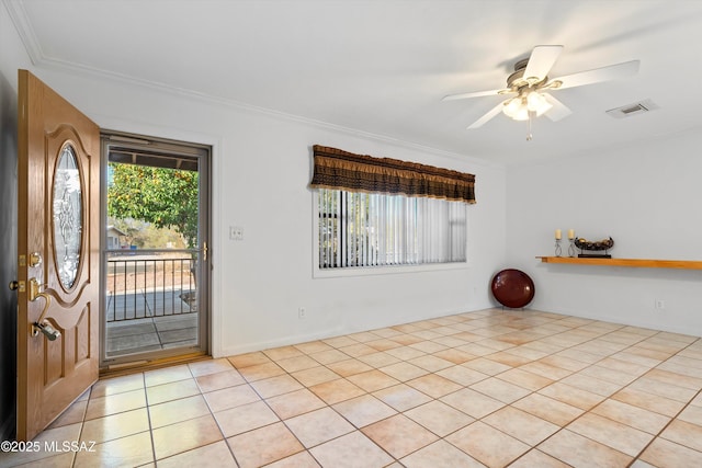 entrance foyer with ceiling fan, light tile patterned floors, visible vents, and ornamental molding