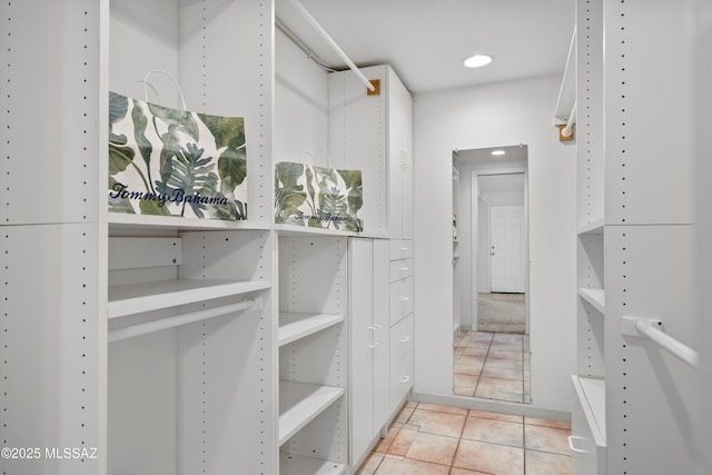 spacious closet featuring tile patterned floors