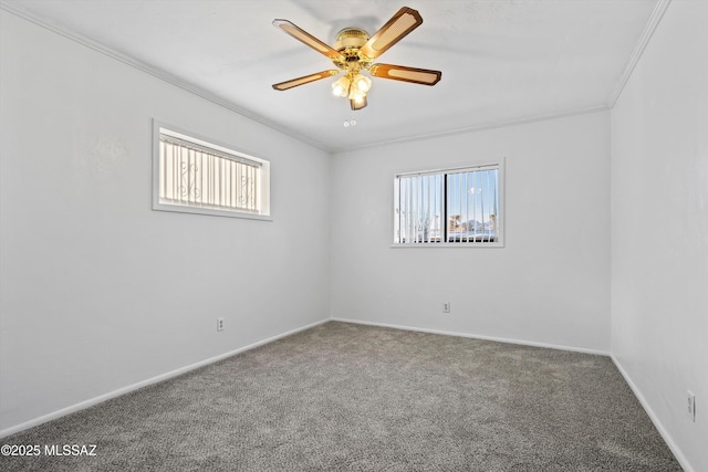 empty room featuring carpet, a ceiling fan, baseboards, and ornamental molding