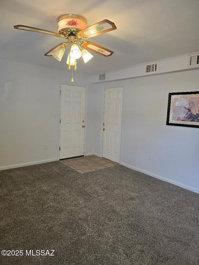 5822 E S Wilshire Dr, Tucson, AZ 85711 - spare room featuring carpet floors, baseboards, and ceiling fan