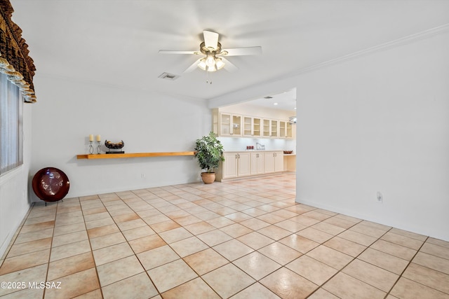 5822 E S Wilshire Dr, Tucson, AZ 85711 - empty room with ceiling fan, light tile patterned floors, and crown molding
