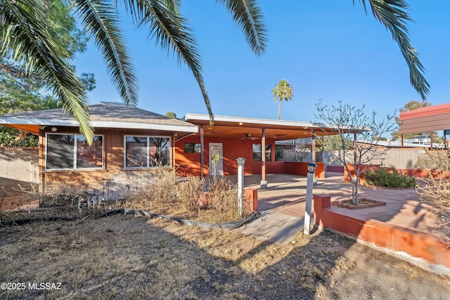 view of front facade with a patio area and ceiling fan