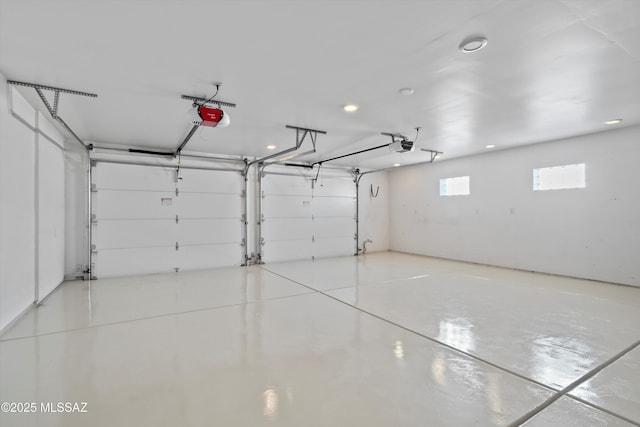 5822 E S Wilshire Dr, Tucson, AZ 85711 - garage featuring a garage door opener and recessed lighting