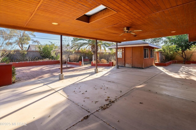 5822 E S Wilshire Dr, Tucson, AZ 85711 - view of patio / terrace with an outbuilding, a fenced backyard, and ceiling fan