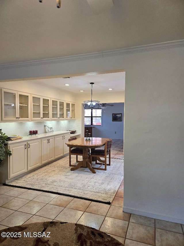 5822 E S Wilshire Dr, Tucson, AZ 85711 - dining space with ornamental molding and a chandelier