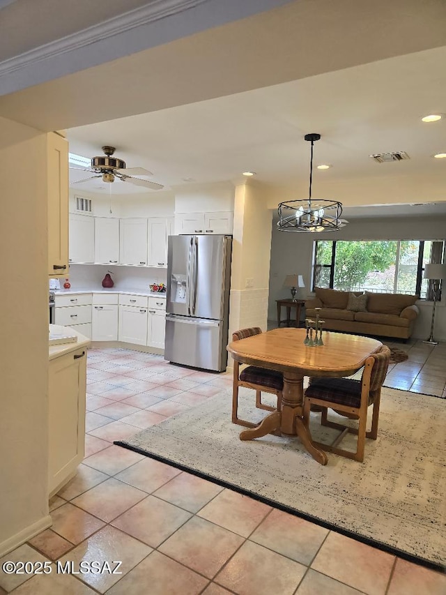 5822 E S Wilshire Dr, Tucson, AZ 85711 - dining area with light tile patterned floors, recessed lighting, a chandelier, and a ceiling fan