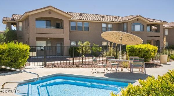 view of swimming pool with a patio, fence, and a fenced in pool