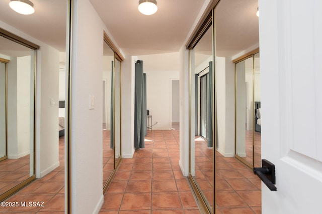 hallway featuring tile patterned flooring