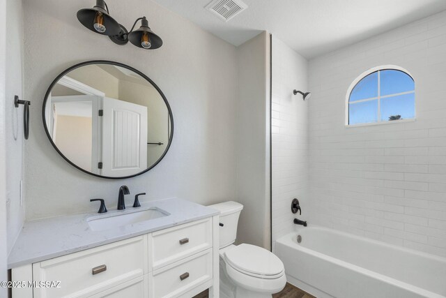 bathroom with shower / bath combination, visible vents, toilet, and vanity