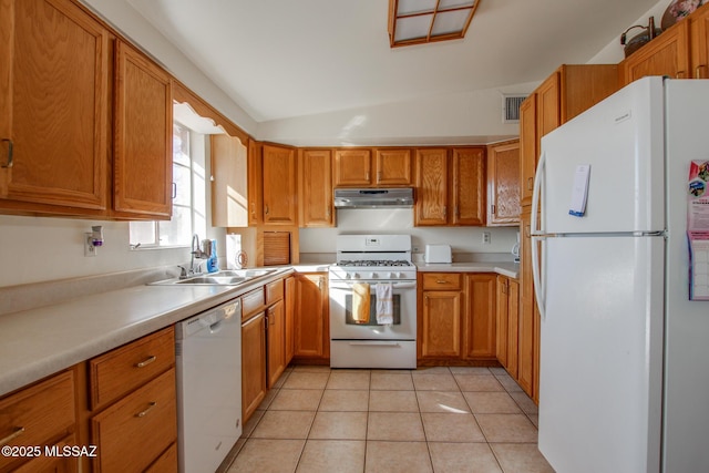 kitchen with visible vents, light countertops, a sink, white appliances, and under cabinet range hood