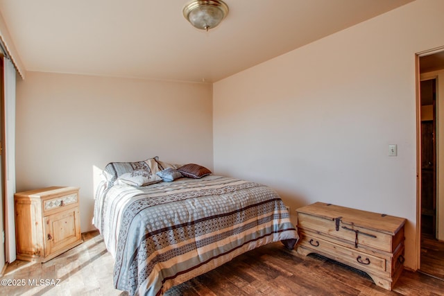 bedroom with wood finished floors