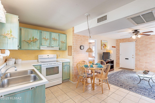 kitchen featuring visible vents, electric range, a sink, green cabinetry, and under cabinet range hood