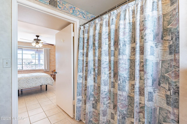 full bathroom with tile patterned flooring and a ceiling fan