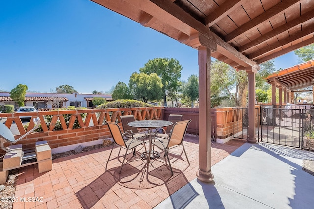 view of patio / terrace featuring outdoor dining space and fence