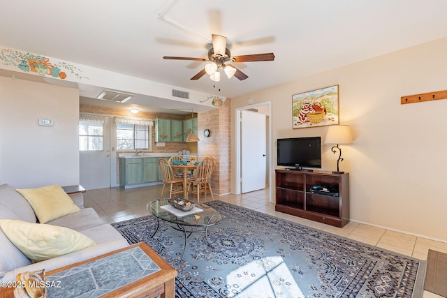 living room with visible vents and light tile patterned floors