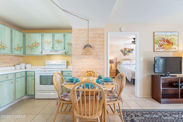 kitchen featuring light countertops, light tile patterned flooring, under cabinet range hood, and white electric range oven