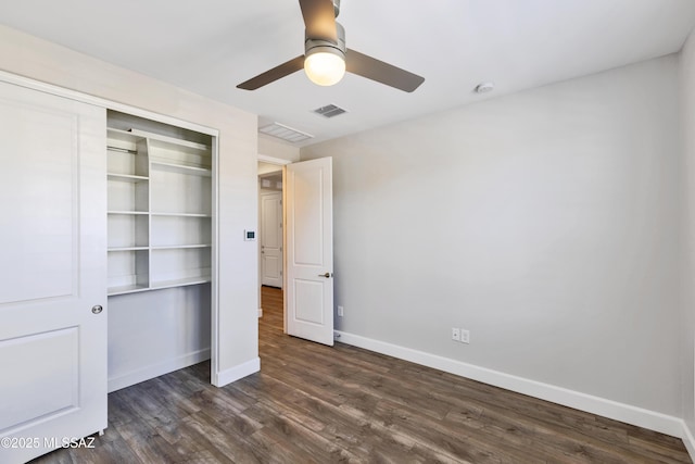 30776 S Sand Hurst Ln, Oracle, AZ 85623 - unfurnished bedroom with a closet, dark wood finished floors, baseboards, and a ceiling fan