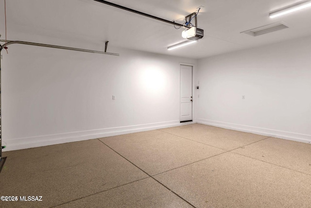 30776 S Sand Hurst Ln, Oracle, AZ 85623 - garage with a garage door opener and baseboards