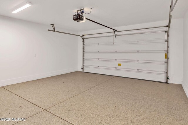 30776 S Sand Hurst Ln, Oracle, AZ 85623 - garage with baseboards and a garage door opener