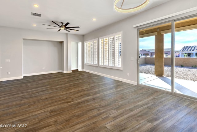 30776 S Sand Hurst Ln, Oracle, AZ 85623 - unfurnished living room with dark wood-style floors, baseboards, a ceiling fan, and recessed lighting