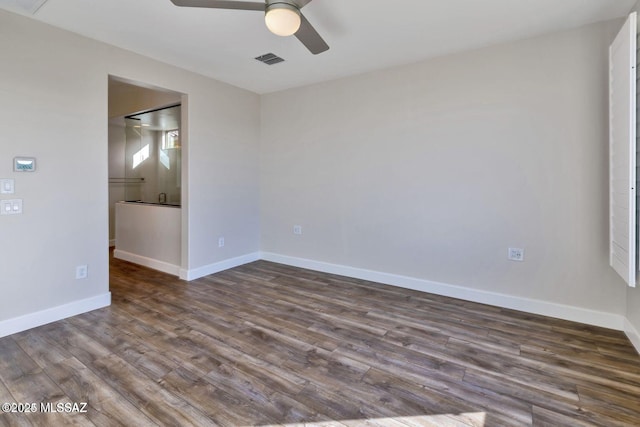 30776 S Sand Hurst Ln, Oracle, AZ 85623 - unfurnished room with a ceiling fan, dark wood-style floors, and baseboards