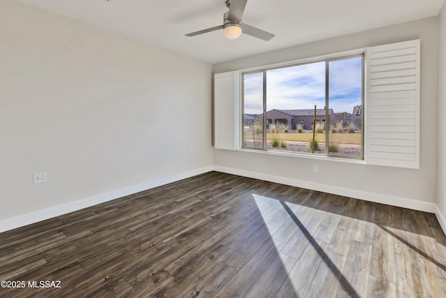 30776 S Sand Hurst Ln, Oracle, AZ 85623 - empty room with baseboards, dark wood-type flooring, and ceiling fan
