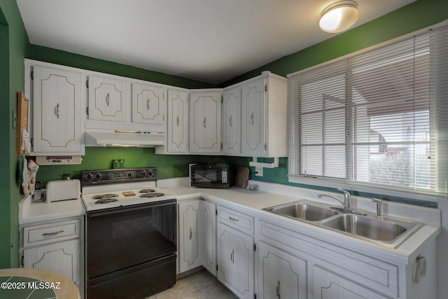 kitchen featuring white cabinets, electric stove, under cabinet range hood, black microwave, and a sink