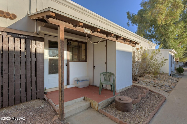 property entrance with fence