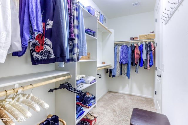 spacious closet with visible vents and carpet flooring