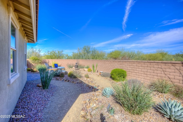 view of yard with a fenced backyard