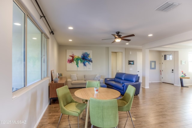 dining room featuring visible vents, baseboards, recessed lighting, wood finished floors, and a ceiling fan