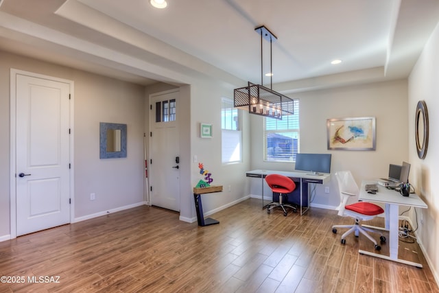 office space featuring recessed lighting, a chandelier, baseboards, and wood finished floors