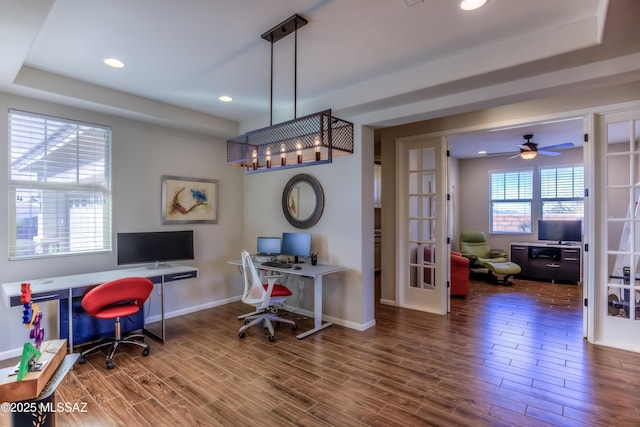 home office featuring baseboards, a tray ceiling, recessed lighting, french doors, and wood finished floors