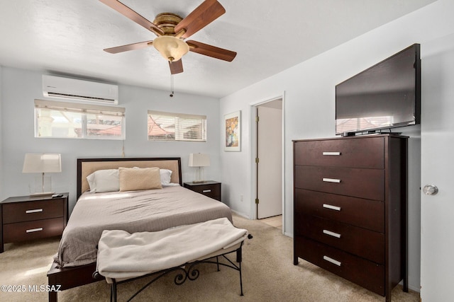 bedroom with light carpet, ceiling fan, and a wall mounted AC