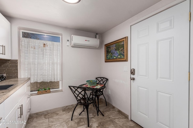 doorway to outside featuring a sink and a wall mounted air conditioner