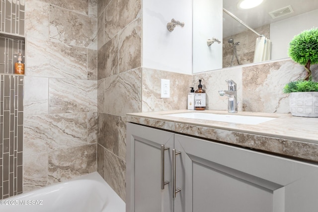 full bathroom featuring shower / bathtub combination with curtain, visible vents, backsplash, and vanity