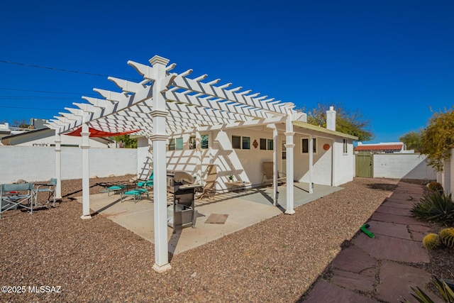 view of patio / terrace with a fenced backyard and a pergola