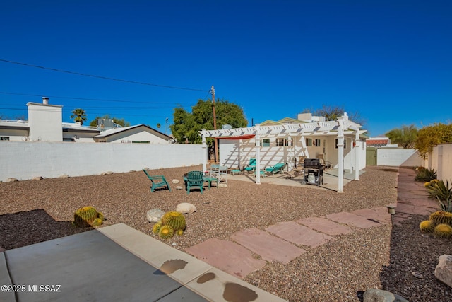 view of yard with a patio area, a fenced backyard, and a pergola