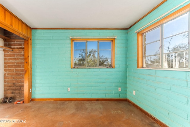 unfurnished room with concrete flooring