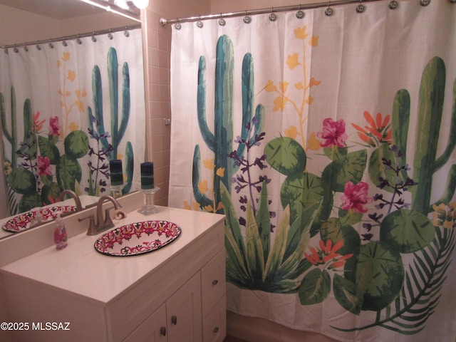 full bath with a shower with curtain and vanity