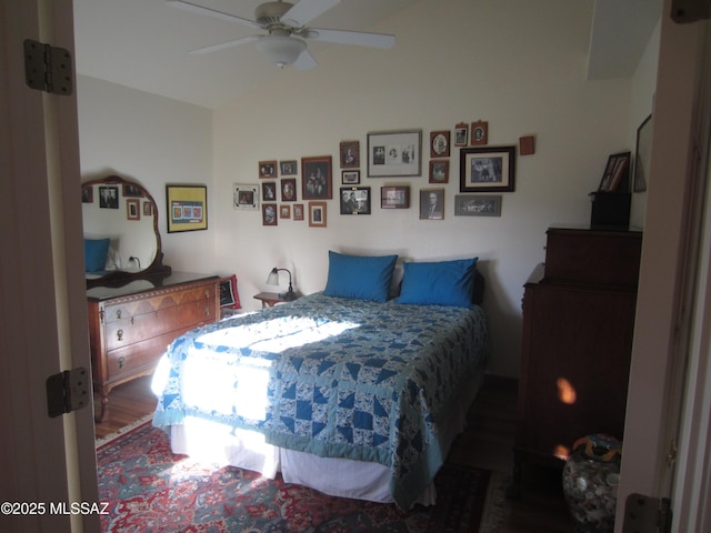 bedroom featuring lofted ceiling and a ceiling fan