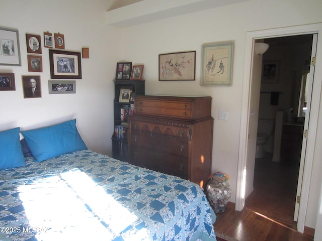 bedroom with wood finished floors